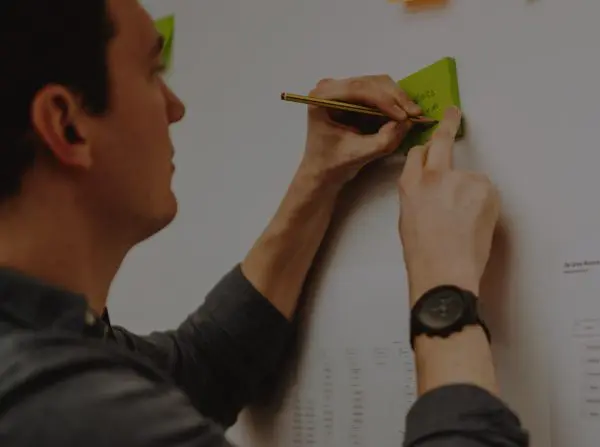 Ponderosa workshop placing post-its on wall