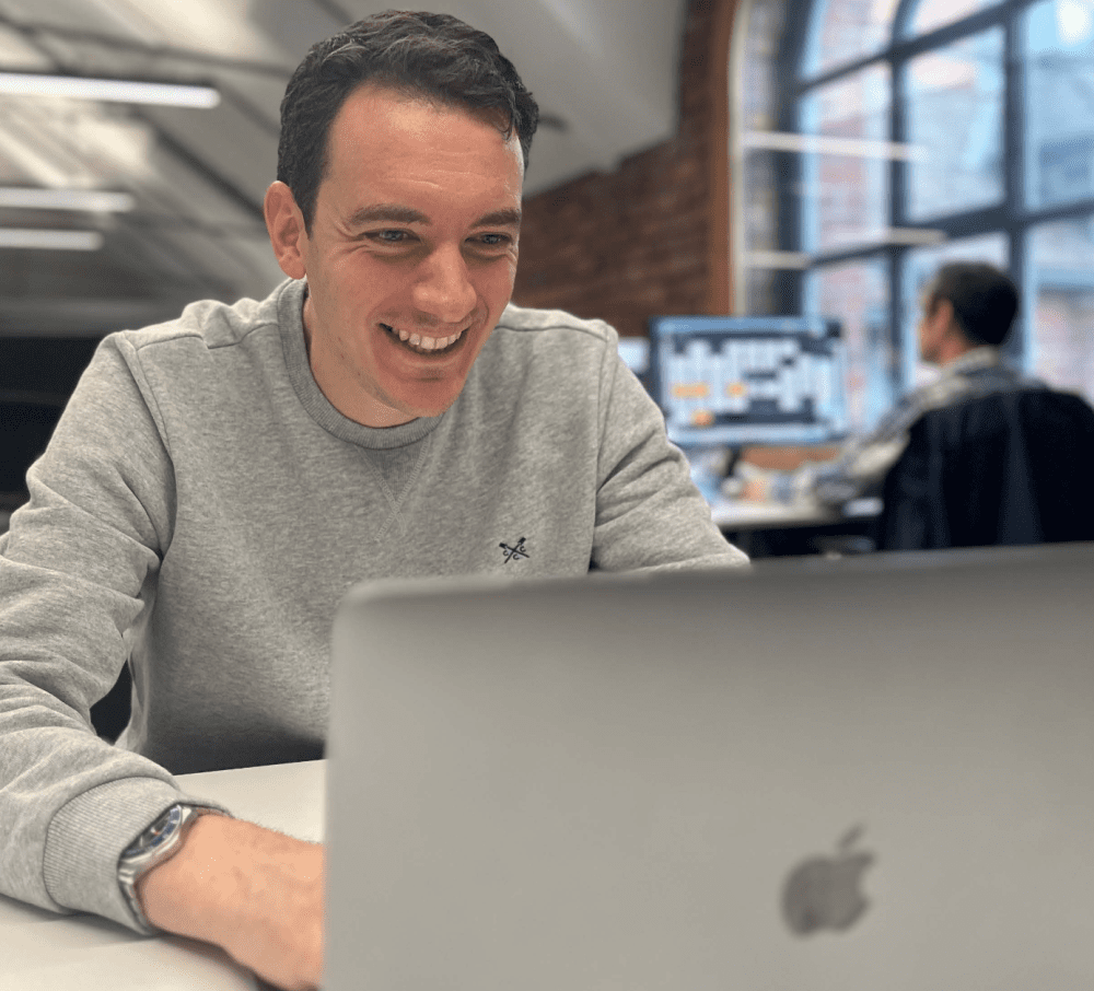 Adam Irwin on his computer