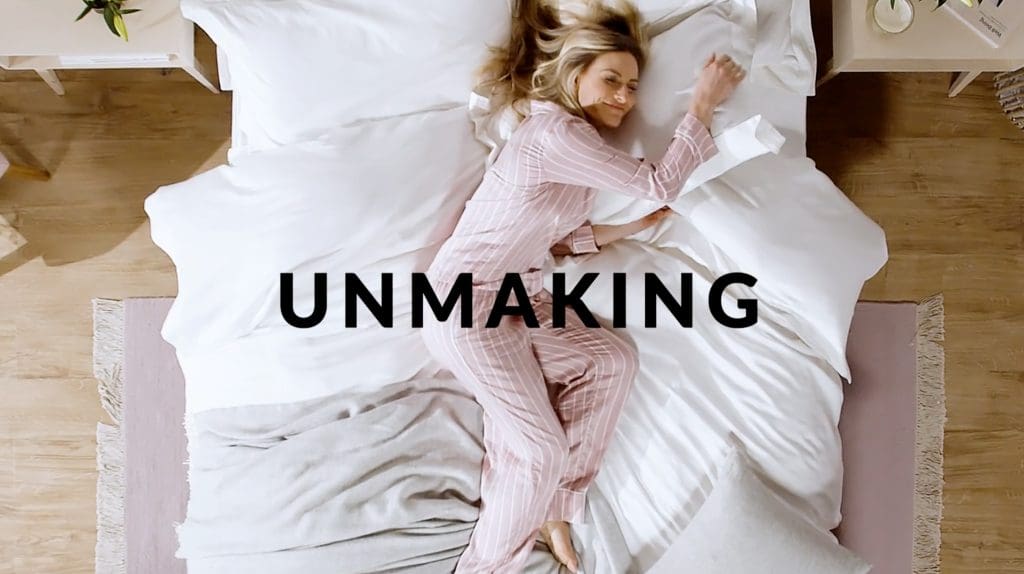 DUSK "Made for Unmaking" Advert screenshot - lady lying in bed