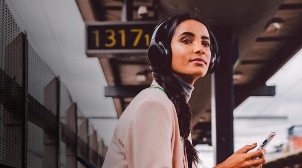 Audio-Technica-Banner Lady on train platform wearing Audio Technica headphones